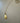 Product picture of Annabelle: a long necklace in gold. Productfoto van Annabelle: een lange gouden ketting.