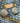 Close-up picture of ice blue Pippa gold statement earrings. Close-up foto van ijsblauwe Pippa gouden statement oorbellen.