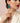 A model is wearing long gold earrings - Franca in turquoise. Een model draagt lange goude oorbellen - Franca in turquoise. 