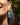 Close-up picture of turquoise gold Anna earrings worn on a model. Close-up foto van turquoise gouden Anna oorbellen gedragen door een model.